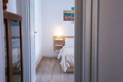 a small bedroom with a bed and a closet at Delia's Vatican House Near St Peter's in Rome