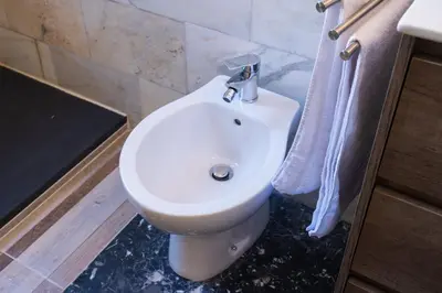 a bathroom with a white toilet and a sink at Delia's Vatican House Near St Peter's in Rome