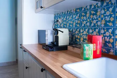 a kitchen with a counter top with a toaster and aounter at Delia's Vatican House Near St Peter's in Rome