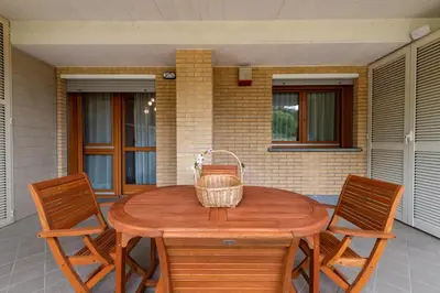 a wooden table with two chairs and a basket on it at Bonum Vitae in Rome