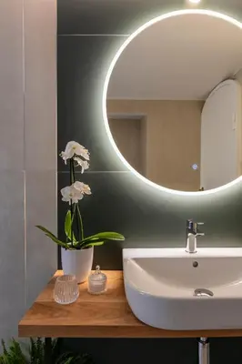 a bathroom with a sink and a mirror at Residenza Il Vicolo by Hili in Rome