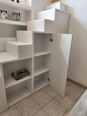 a white closet with white shelves in a room at Appartamento Loft ex mulini in Rome