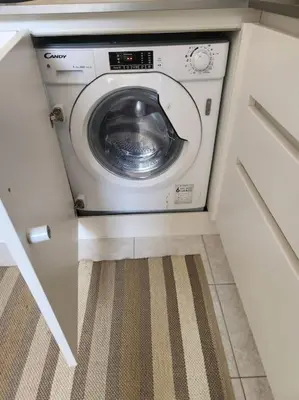 a washer and dryer in a small room at Appartamento Loft ex mulini in Rome