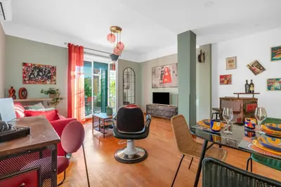 a living room with a table and chairs at Conca D'Oro Terrace in Rome