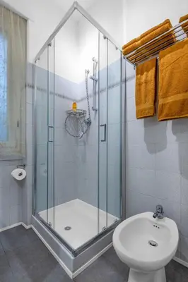 a bathroom with a shower and a toilet and a sink at Conca D'Oro Terrace in Rome