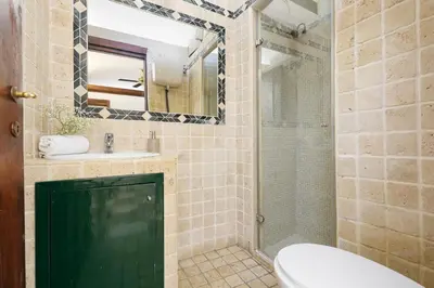 a bathroom with a toilet and a sink and a shower at Campitelli 9 - Loft in Ancient Rome in Rome