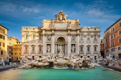 a building with a fountain in front of it at Ninkasi Bed and Beer San Giovanni Via La Spezia 74 Roma in Rome