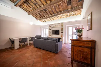 a living room with a couch and a table at Domus Laurina - Maison D'Art Collection in Rome