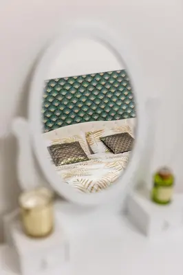a mirror reflection of two pillows on a table at Colosseum Boutique apartment in Rome