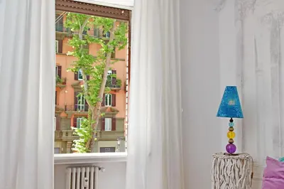 a window with a view of a building at Charme e Style: Splendid Apartment with 2 Bedrooms in Rome