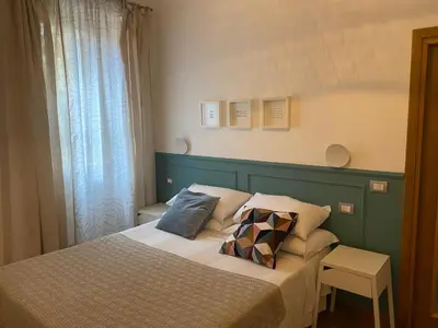 a bedroom with a bed with two pillows on it at Fanfulla Bilocale Pigneto in Rome