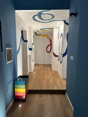 a hallway with a room with a painting on the ceiling at Casa Cipradino in Rome