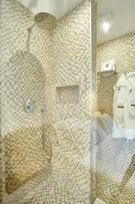 a shower with a glass door in a bathroom at Casa Cipradino in Rome