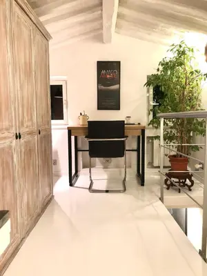 an office with a desk and a chair at Navona Luxury Suite Apartment by NDP rent in Rome