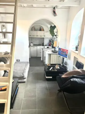 a room with a staircase and a living room at Navona Luxury Suite Apartment by NDP rent in Rome