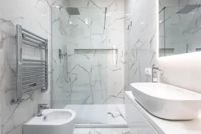 a white bathroom with a sink and a toilet at Alissa Suite in Rome