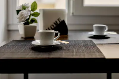 two cups and saucers sitting on a table at Vatican View in Rome