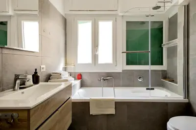 a bathroom with a tub and a sink and a toilet at Vatican View in Rome