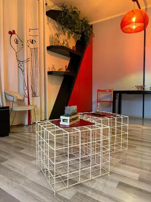 a room with a coffee table in the middle at Dora Apartment in Rome