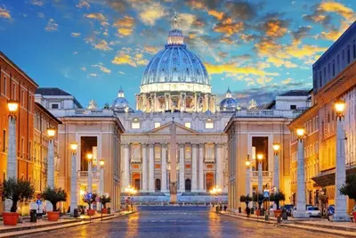 a large white building with a domed building at Residenza AURELIA in Rome