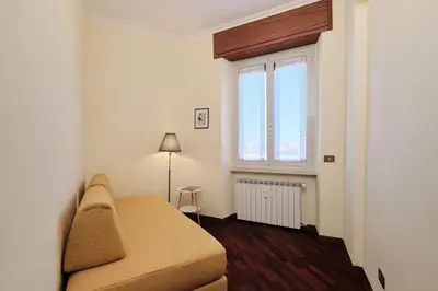 a small room with a bed and a window at Centro Storico a 15' - Cata Apartment Roma in Rome