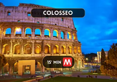 a sign in front of the colosseum at night at Centro Storico a 15' - Cata Apartment Roma in Rome