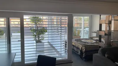 a room with a view of a balcony at Caesars penthouse in Rome