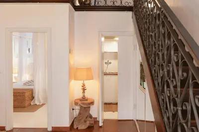 a hallway with a staircase leading to a bedroom at Piazza Navona Historic Luxury Apartment in Rome