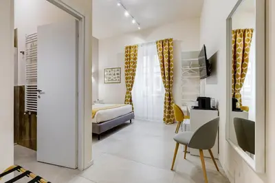 a living room with a bed and a couch at SCIPIONI 40 GUESTHOUSE in Rome
