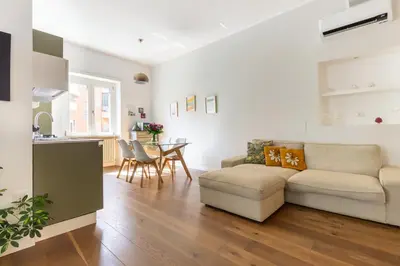 a living room with a couch and a table at Apartment near the Vatican Cipro metro station in Rome