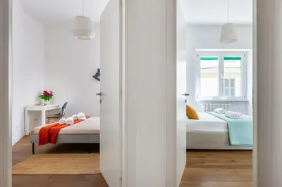 a bedroom with two beds and a window at Apartment near the Vatican Cipro metro station in Rome