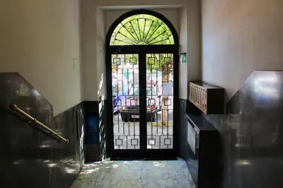 a door with a stained glass window in a hallway at Your Perfect Roman Getaway in Vatican in Rome