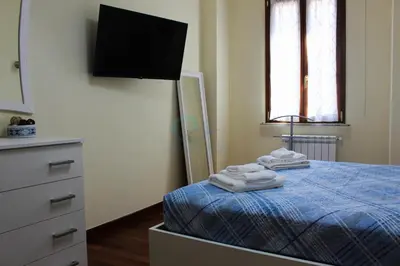 a bedroom with a bed with towels on it at Your Perfect Roman Getaway in Vatican in Rome