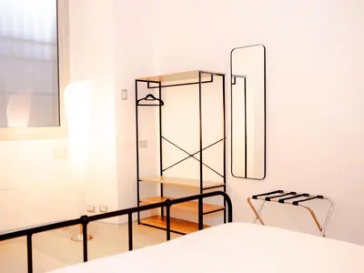 a bedroom with a mirror and a shelf at Magikrooms Kandy in Rome