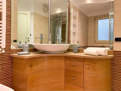 a bathroom with a large white bowl sink on a counter at Be Close - Porta Portese Appartamento con terrazza in Rome