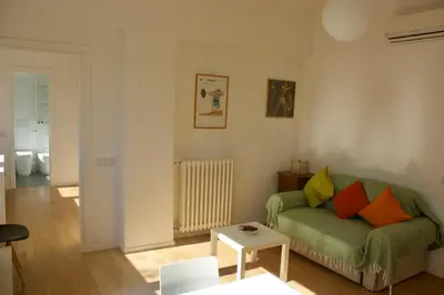 a living room with a couch and a table at Quadrilatero Flat in Rome