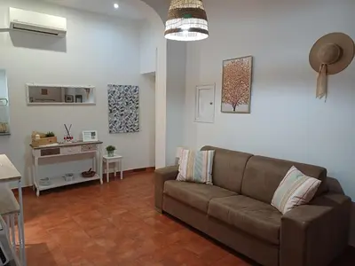 a living room with a couch and a table at Il barone di Trastevere in Rome