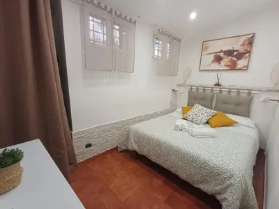 a bedroom with a bed with two towels on it at Il barone di Trastevere in Rome
