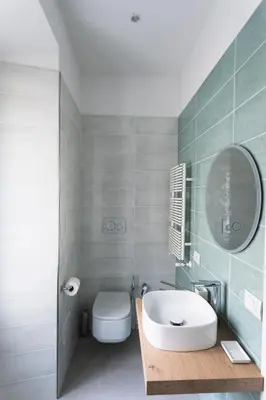 a bathroom with a sink and a toilet and a mirror at Circolo degli Scipioni in Rome