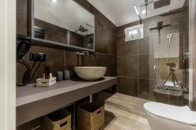 a bathroom with a sink and a toilet at MauveSweetRhome 3 in Rome