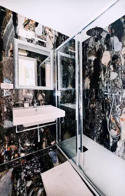 a bathroom with a sink and a mirror at Vatican Suites in Cola Di Rienzo in Rome