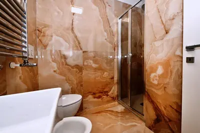 a bathroom with a shower and a toilet at Vatican Suites in Cola Di Rienzo in Rome