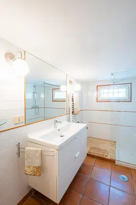 a kitchen with a table and chairs in a room at Milvio Urban House in Rome