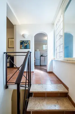 a white bathroom with a sink and a toilet at Milvio Urban House in Rome