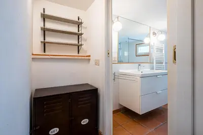 a bedroom with a bed and a dresser and a mirror at Milvio Urban House in Rome