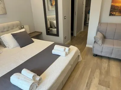 a bedroom with two beds with towels on them at Niky House Roma in Rome