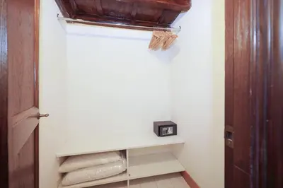 a closet with a white shelf with towels on it at Golden Pantheon Rooms in Rome