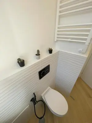 a white toilet in a room with a window at Vatican Hill Apt in Rome