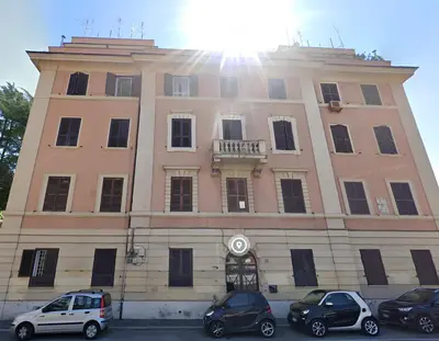a building with cars parked in front of it at Vatican Hill Apt in Rome