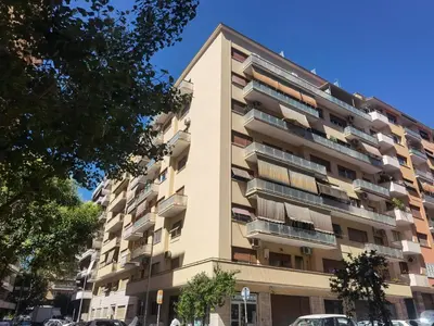an apartment building with balconies on a street at Millelire Vatican Terrace in Rome